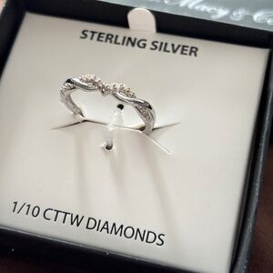 Diamond Twist Ring (1/10 ct. t.w.) in Sterling Silver